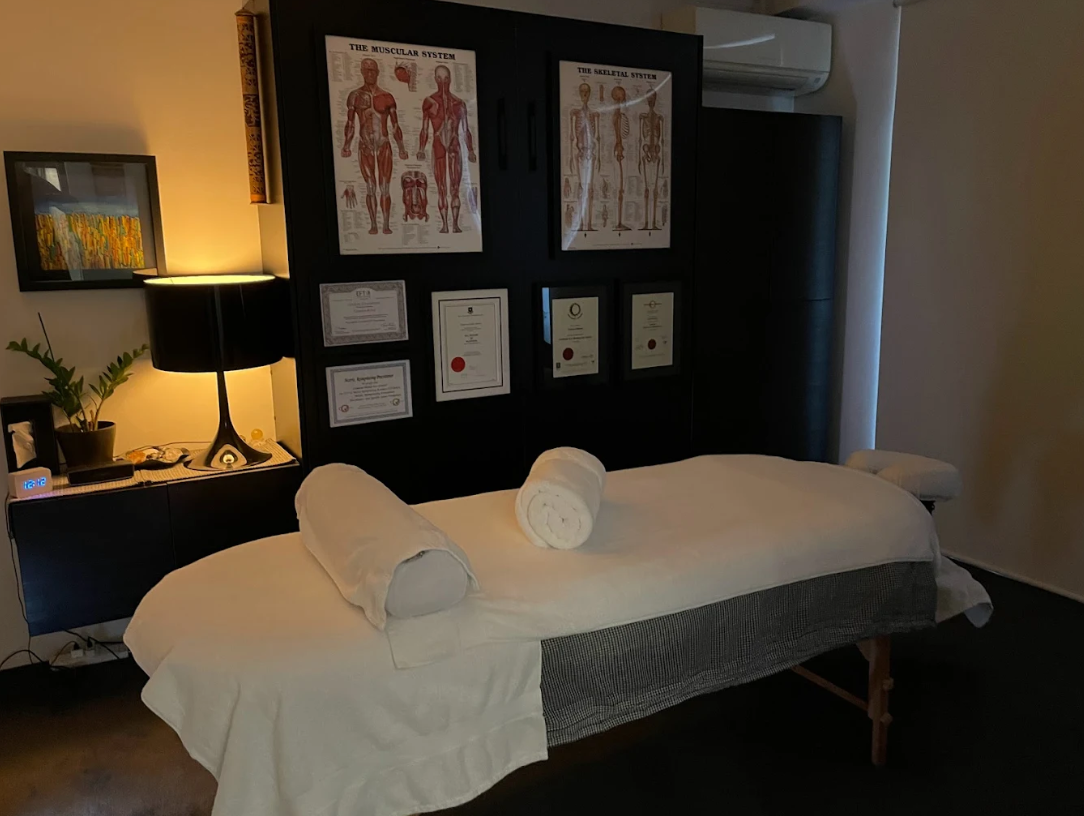 Professional treatment room with massage table